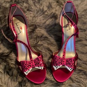 Gorgeous piper zoe fuchsia satin high heel shoe embezzled with black stones.